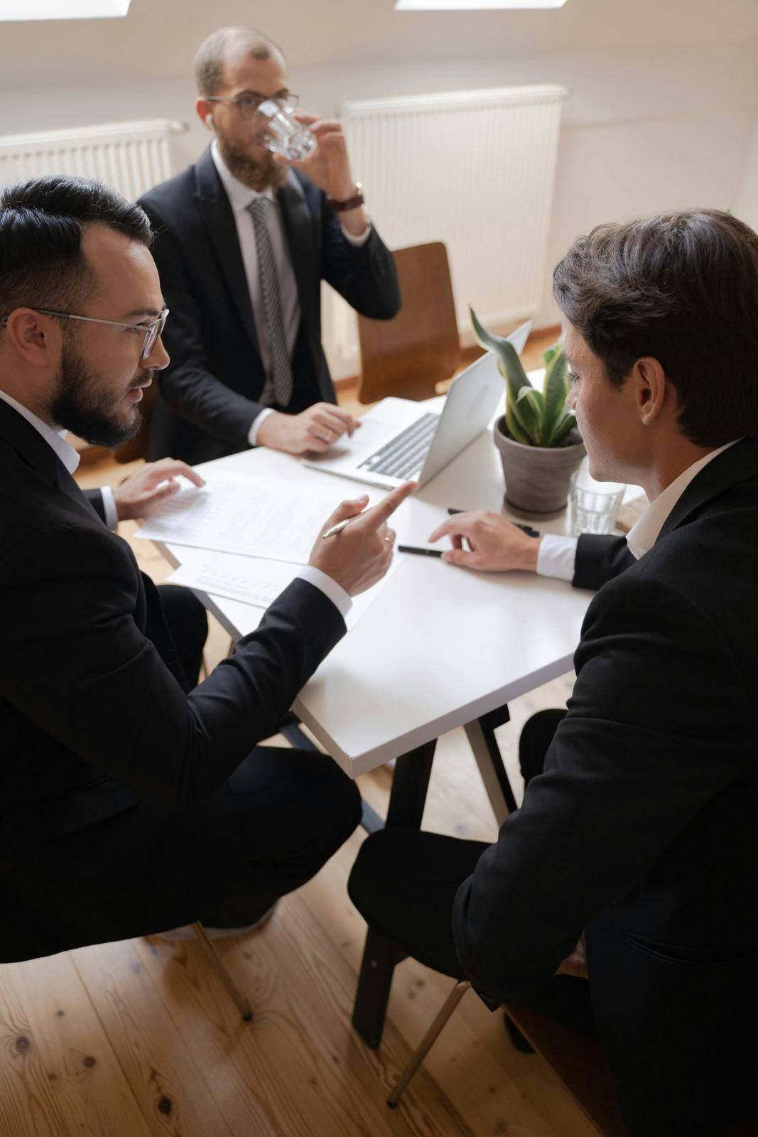 Business meeting with three men